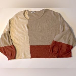 Staccato sweater with color block detail.